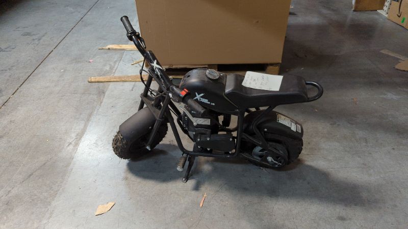 Photo 1 of xtreme power us mini bike Black 

*Pull Cord Stuck
*Rear Break Seized
*Has Gas In Tank
*Outside Paint has Gas Corrosion  