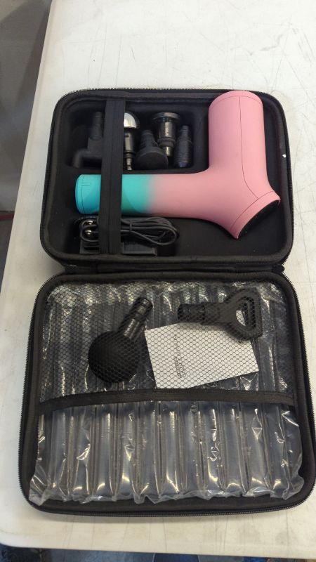 Photo 3 of BCORE MASSAGE GUN CHARGES 6 HOURS FOR FULL POWER 10 SPEED LEVELS 6 ADJUSTABLE HEADS FOR UPPER BODY OR LOWER BODY COLOR MINT AND PINK NEW 