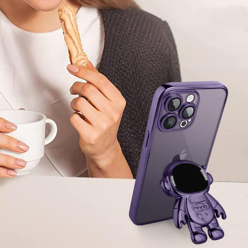 Photo 2 of AIGOMARA 6D Plating Astronaut Hidden Stand Case Cover for iPhone 14 Pro Max Women Astronaut Folding Bracket Kickstand iPhone Case with Camera Protector Soft TPU Shockproof Bumper 6.7 in 2021 - Purple