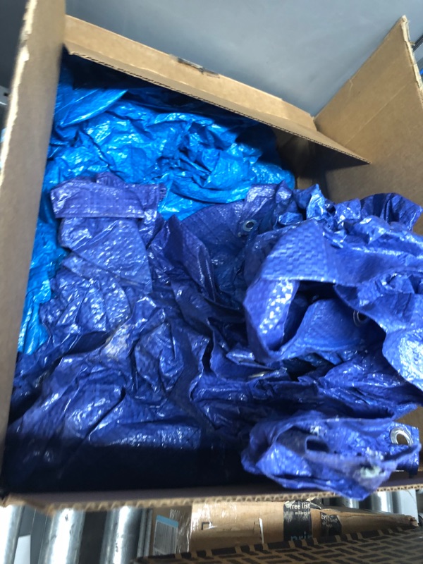 Photo 2 of **EXACT SIZE UNKNOWN**
 Multi-Purpose Poly Tarp – Blue Tarpaulin Protector for Cars, Boats, Construction Contractors, Campers, and Emergency Shelter. Rot, Rust and UV Resistant Protection Sheet
