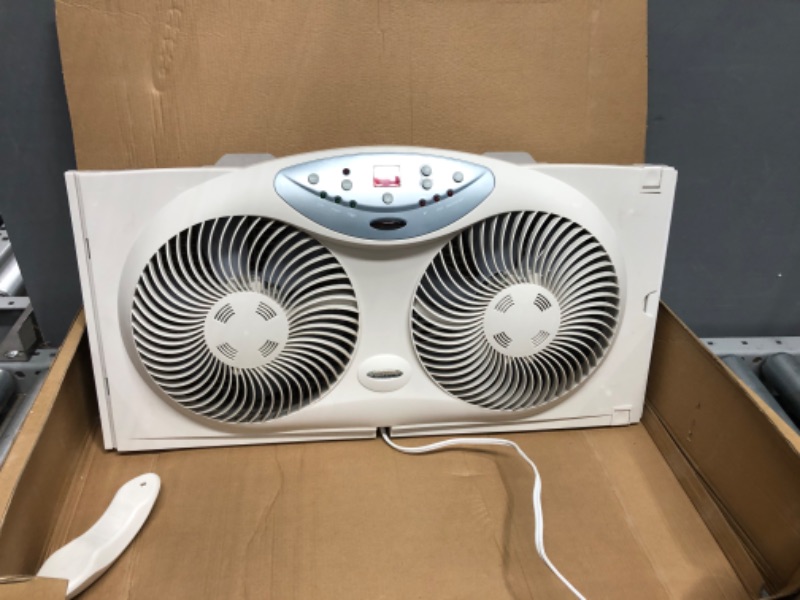 Photo 2 of *PARTS ONLY* NON-FUNCTIONAL*

Bionaire Window Fan with Twin 8.5-Inch Reversible Airflow Blades and Remote Control, White & Holmes Dual 8" Blade Twin Window Fan with Manual Controls, 3 Speed Settings, White
