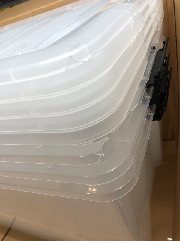 Photo 3 of IRIS USA 72 Qt. Plastic Storage Bin Tote Organizing Container with Durable Lid and Secure Latching Buckles, Stackable and Nestable, 4 Pack, clear with Black Buckle g) 72 Qt. - 4 Pack