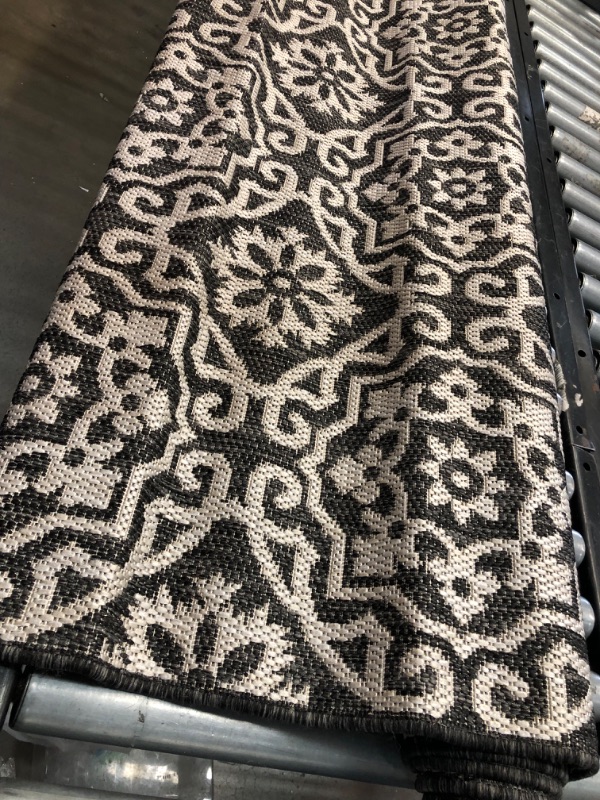 Photo 4 of **used, needs cleaning**
Nicole Miller New York Patio Country Danica Transitional Geometric Indoor/Outdoor Area Rug, Black/Grey, 5'2"x7'2" 5'2"x7'2" Rectangle Black/Grey