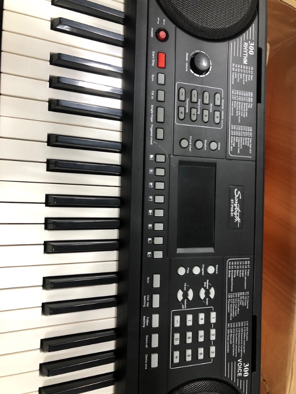 Photo 3 of Sawtooth 61 Key Portable Electronic Digital Keyboard Piano with Chromacast Stand, Headphones, Adapter, Built in Metronome & 50 Preset songs to play along with
