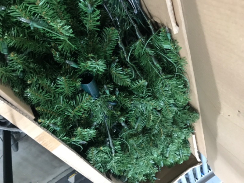 Photo 1 of National Tree Company Artificial Pre-Lit Slim Christmas Tree, Green, Kingswood Fir, White Lights, Includes Stand, 9 Feet
