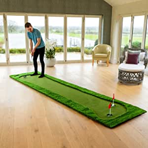 Photo 1 of  Golf Putting Mat –  Artificial Grass Texture Putting Green – with two tun holes  two red flags four white balls four yellow balls and a black carrying bag 

