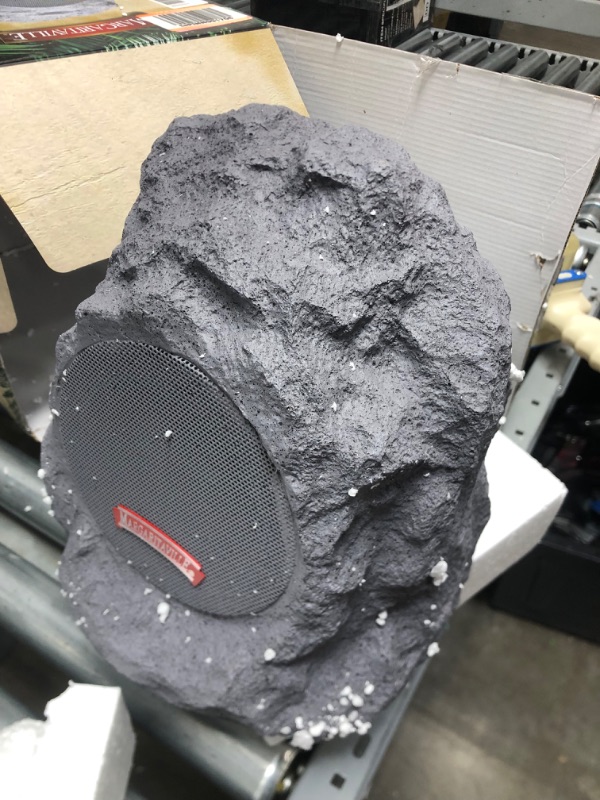 Photo 2 of **tested, powers on**damaged**
Margaritaville Outdoor Rock Bluetooth Wireless Speaker | Durable Bluetooth Speakers, Fantastic Yard or Patio Decor, IPX-4 Waterproof Rated, Granite Grey “On The Rock Natural 1 Pack Speaker