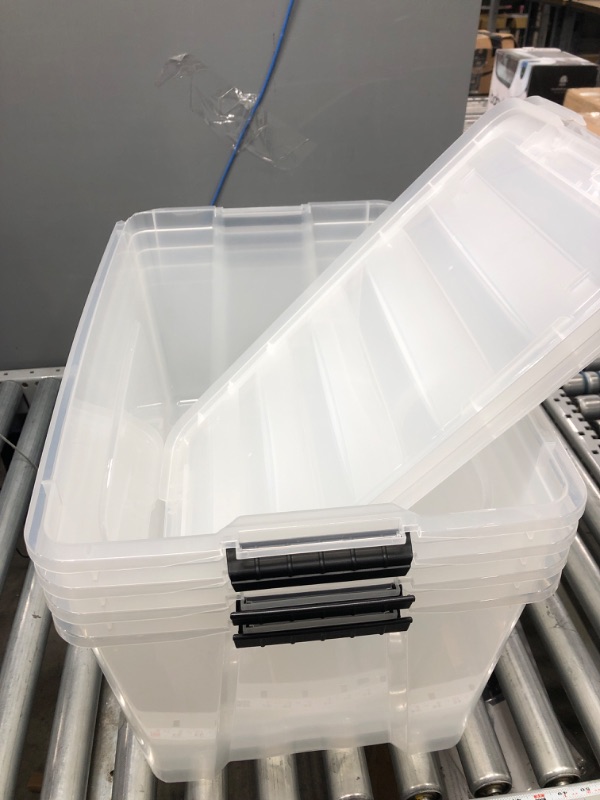 Photo 2 of IRIS USA 72 Qt. Plastic Storage Bin Tote Organizing Container with Durable Lid and Secure Latching Buckles, Stackable and Nestable, 4 Pack, clear with Black Buckle g) 72 Qt. - 4 Pack