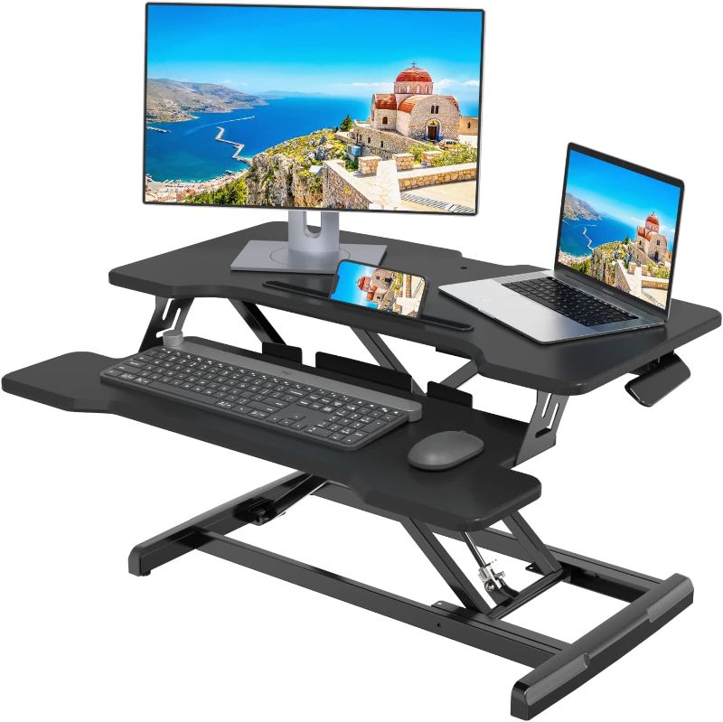 Photo 1 of Joy Seeker Standing Desk Converter 30 Inches Stand up Desk Riser, Height Adjustable Dual Tier Sit Stand Tabletop Monitor Riser Workstation for Home Office with Deep Keyboard Tray for Laptop
