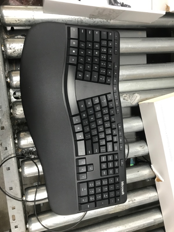 Photo 2 of Microsoft Ergonomic Keyboard - Black. Wired, Comfortable, Ergonomic Keyboard with Cushioned Wrist and Palm Support. Split Keyboard. Dedicated Office Key.
