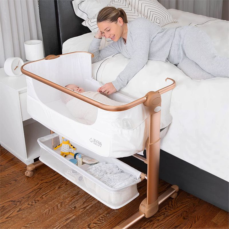 Photo 1 of Baby Bassinet, Bedside Sleeper for Baby, Easy Folding Portable Crib with Storage Basket for Newborn, Bedside Bassinet, Comfy Mattress/Travel Bag Included (White and Gold)