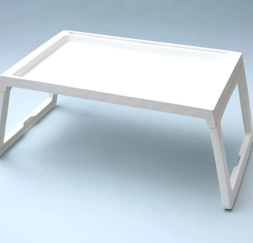 Photo 1 of 24x15 white plastic table for the bed