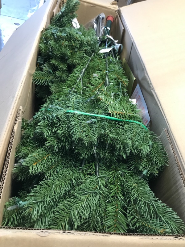 Photo 3 of National Tree Company Pre-lit 'Feel Real' Artificial Full Downswept Christmas Tree, Green, Douglas Fir, White Lights, Includes Stand, 7 feet 7 ft Christmas Tree