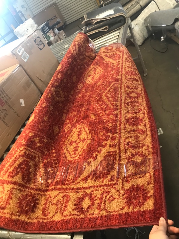 Photo 1 of 5' x7' red and yellow area rug