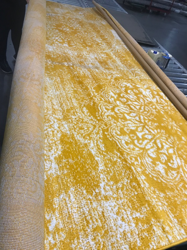 Photo 1 of 8ft by 10ft yellow and white pattern area rug