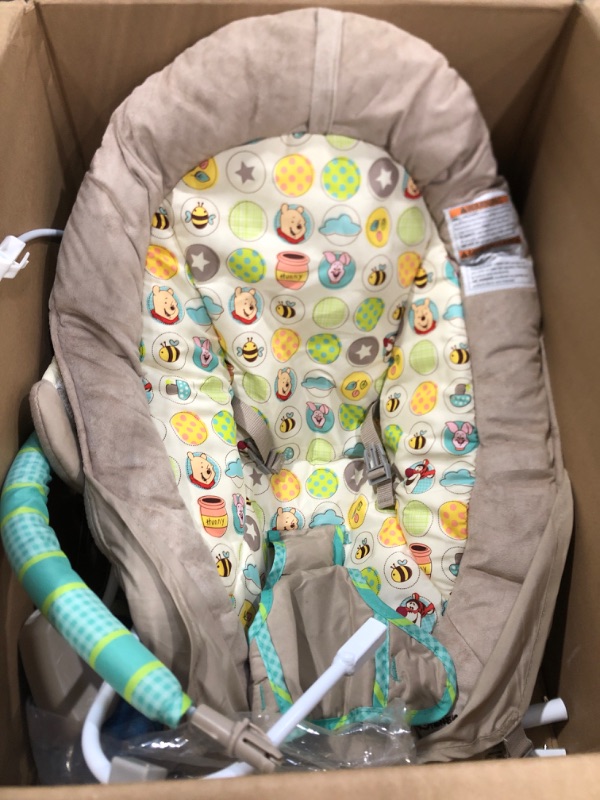 Photo 3 of Bright Starts Winnie the Pooh Dots & Hunny Pots Baby Bouncer with Vibrating Infant Seat, Music & 3 Playtime Toys, 23x19x23 Inch
