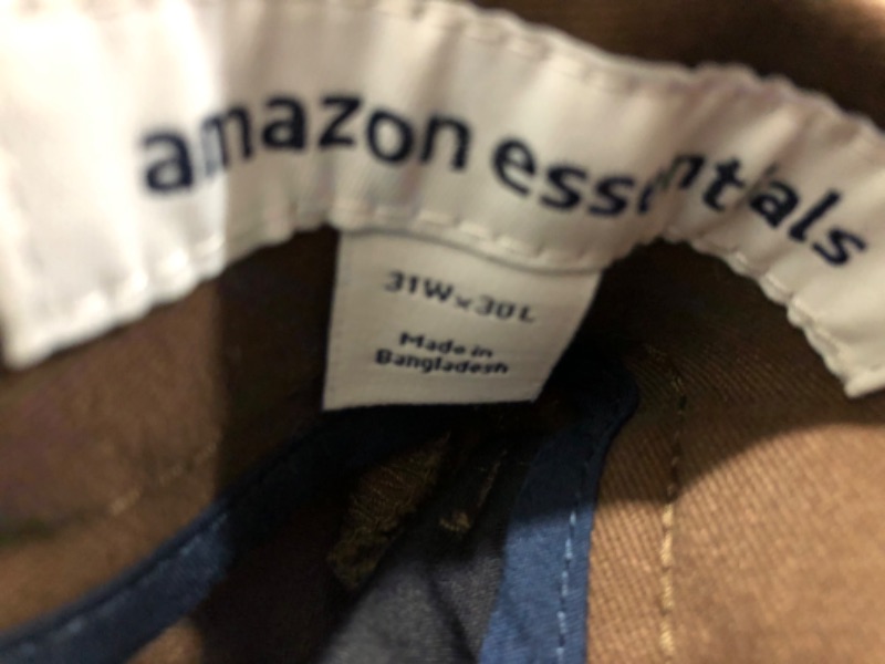 Photo 1 of BUNDLE OF Amazon Essentials Men's Slim-Fit Wrinkle-Resistant Flat-Front Chino Pant, Brown, 31W X 30L
AND AMAZON BASICS SHORTS 31W
