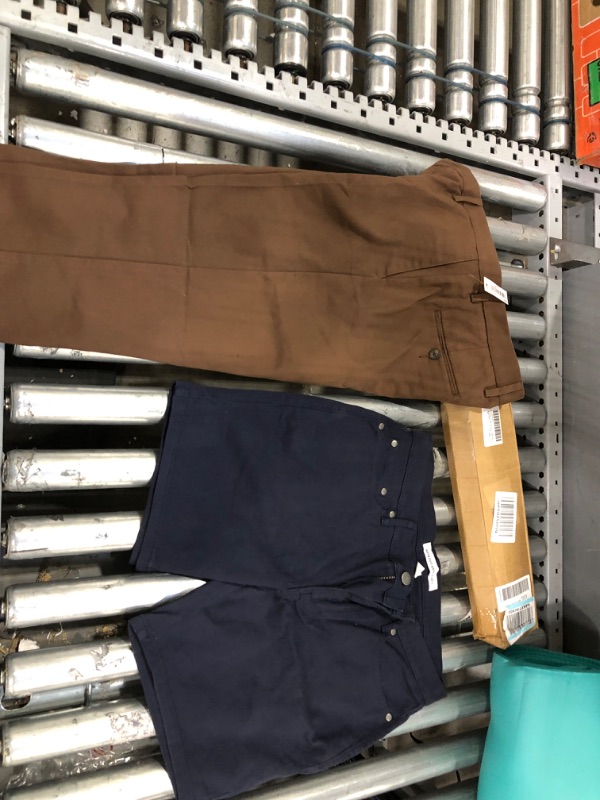 Photo 4 of BUNDLE OF Amazon Essentials Men's Slim-Fit Wrinkle-Resistant Flat-Front Chino Pant, Brown, 31W X 30L
AND AMAZON BASICS SHORTS 31W
