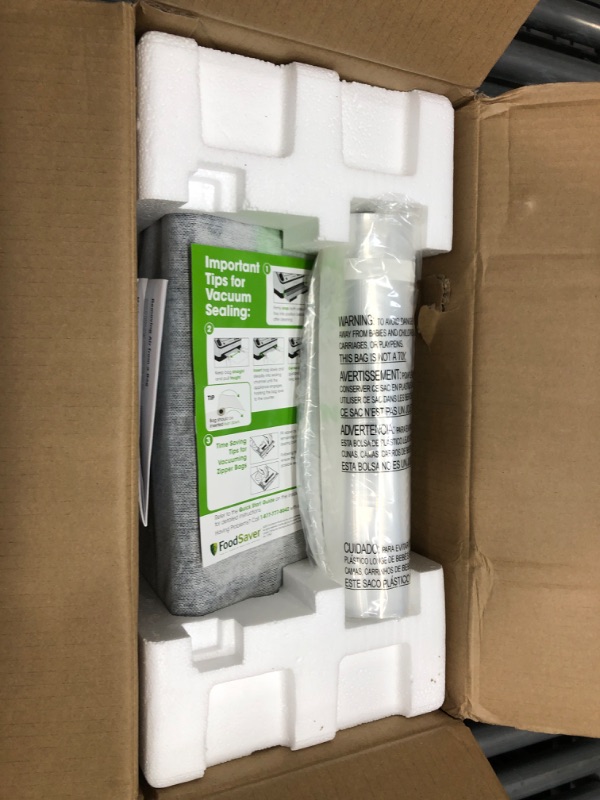Photo 1 of FoodSaver Vacuum Sealer Machine with Automatic Bag Detection, Sealer Bags and Roll, and Handheld Vacuum Sealer for Airtight Food Storage and Sous Vide, Silver
