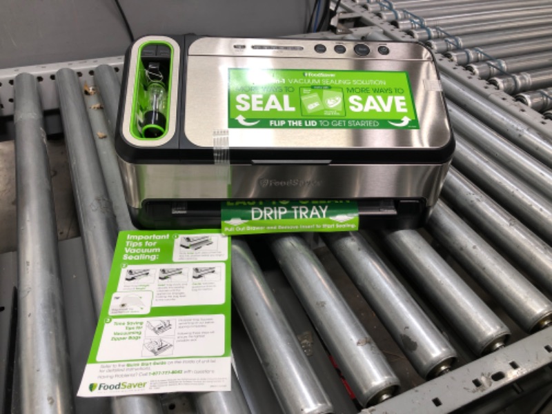 Photo 3 of FoodSaver Vacuum Sealer Machine with Automatic Bag Detection, Sealer Bags and Roll, and Handheld Vacuum Sealer for Airtight Food Storage and Sous Vide, Silver
