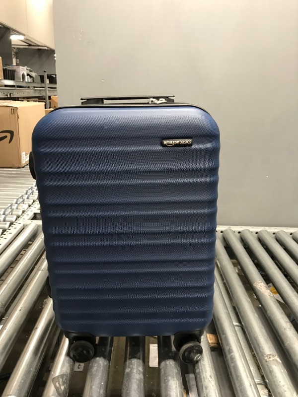 Photo 2 of AmazonBasics Hardside Spinner Luggage, Navy Blue - 24 inch