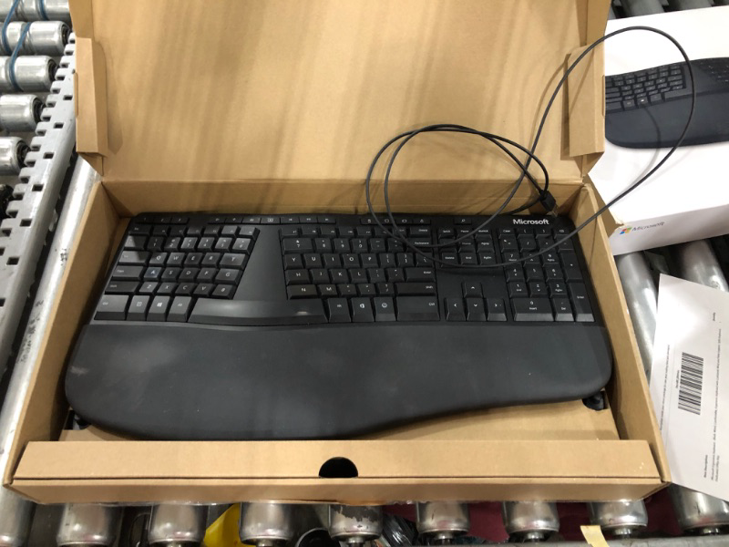 Photo 2 of Microsoft Ergonomic Keyboard - Black. Wired, Comfortable, Ergonomic Keyboard with Cushioned Wrist and Palm Support. Split Keyboard. Dedicated Office Key.
