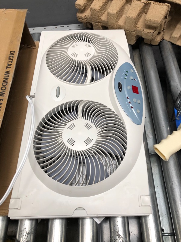 Photo 2 of **used**
Bionaire Window Fan with Twin 8.5-Inch Reversible Airflow Blades and Remote Control, White White 2 Blades Electronic control with LCD screen Window Fan