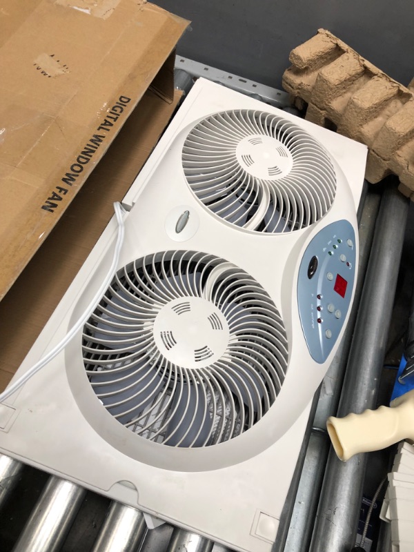 Photo 3 of **used**
Bionaire Window Fan with Twin 8.5-Inch Reversible Airflow Blades and Remote Control, White White 2 Blades Electronic control with LCD screen Window Fan