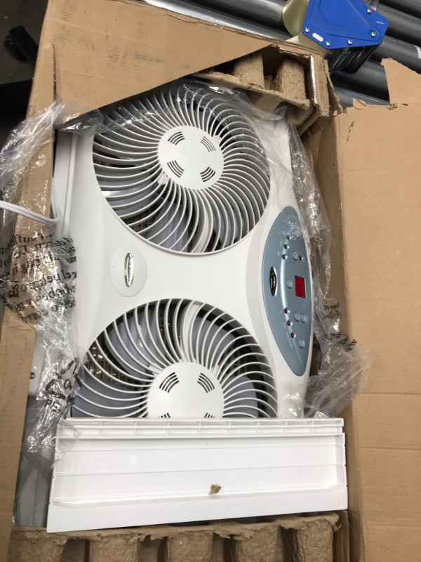 Photo 2 of *nonfunctional* Bionaire Window Fan with Twin 8.5-Inch Reversible Airflow Blades and Remote Control, White White 2 Blades Electronic control with LCD screen Window Fan