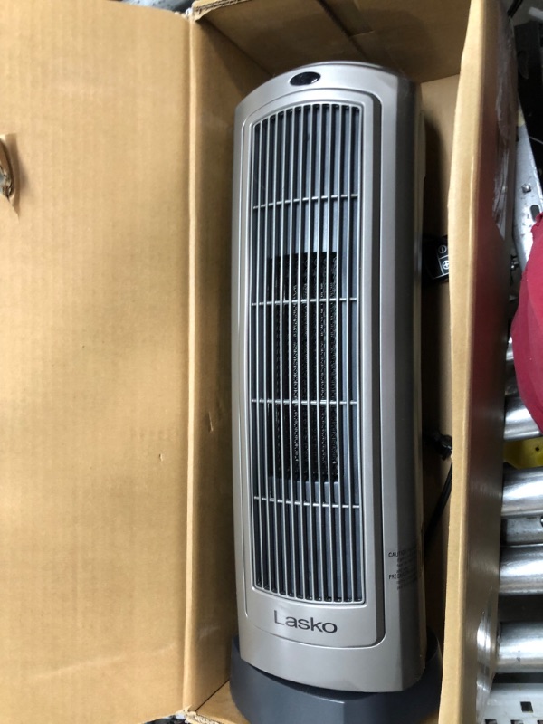 Photo 2 of ***SEE NOTE*** Lasko Oscillating Digital Ceramic Tower Heater for Home with Adjustable Thermostat, Timer and Remote Control, 23 Inches, 1500W, Silver, 755320
