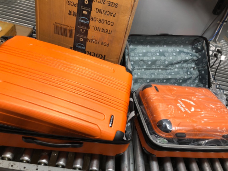 Photo 2 of Rockland London Hardside Spinner Wheel Luggage, Orange, 3-Piece Set (20/24/28)
