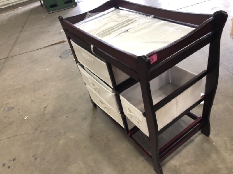 Photo 4 of **DAMAGED LEG NEEDS REPAIR** Badger Basket Sleigh Style Baby Changing Table with Six Baskets, Cherry 37.5L x 19W x 36H (inches)

