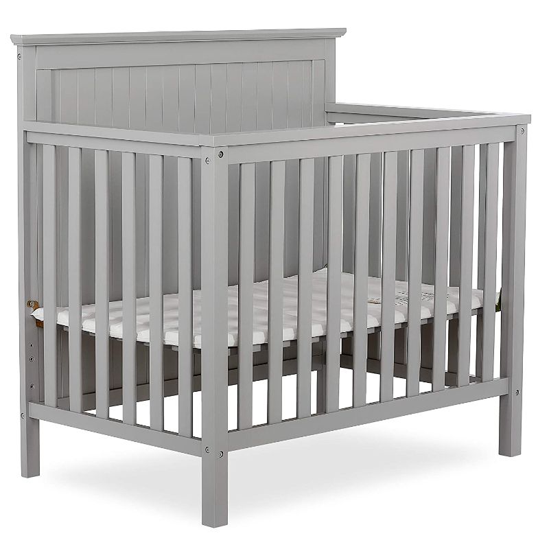 Photo 1 of **MINOR SCUFFS FROM SHIPPING** Dream On Me Ava 4-in-1 Convertible Mini Crib in Pebble Grey, Greenguard Gold Certified, Non-Toxic Finish, Comes with 1" Mattress Pad, with 3 Mattress Height Settings
