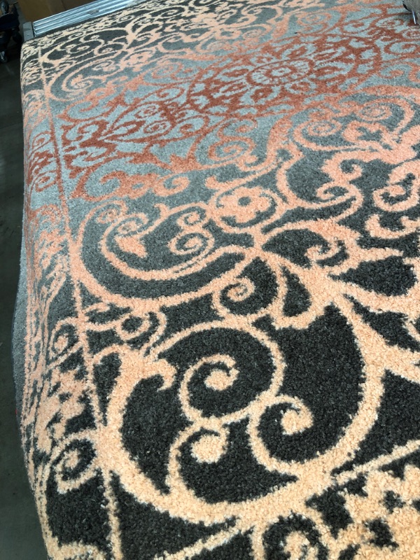 Photo 1 of 5' x 7' area rug  gray pink peach coral color