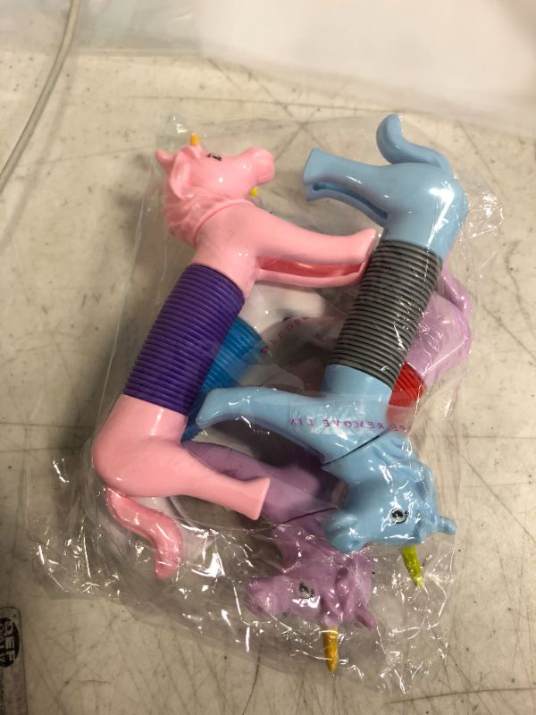 Photo 2 of  4 Pack Unicorn Pop Tube Sensory Stretch Toys 
