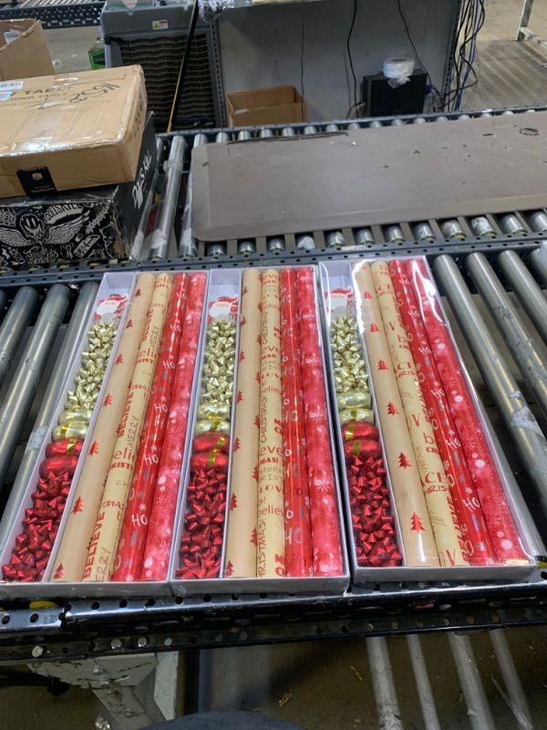 Photo 1 of 3 PACK BUNDLE - Wrapping Paper, 4 Rolls of Red Christmas Birthday Wrapping Paper. Includes Christmas Tree, Snowflake, Merry Christmas, HO HO HO Elements. Includes Decorative Flowers, Ribbons, Labels. Each Roll of Gift Wrap Paper ,Measures 27.5 In X 13 ft
