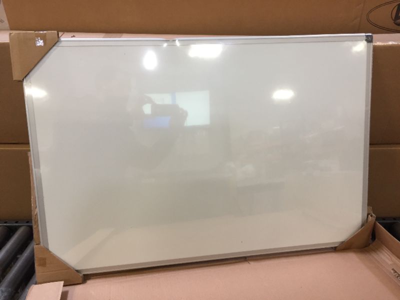 Photo 2 of Amazon Basics Magnetic Dry Erase White Board, 36 x 24-Inch Whiteboard - Silver Aluminum Frame 24" x 36" Magnetic, Aluminum Frame  *** FRAME HAS DENTING FROM PACKAGING ***