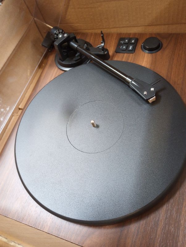 Photo 4 of Record Player Natural Wood with Two Speakers ---- moderate used, scuffs and scratches on item as shown in pictures, turns on