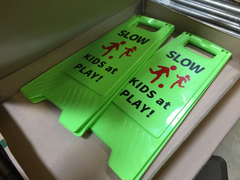 Photo 1 of Slow Kids at Play Sign, Children at Play Safety Signs with Double-Sided Text and Graphics for Street Neighborhoods Schools Park Sidewalk Driveway (2-Pack Green)