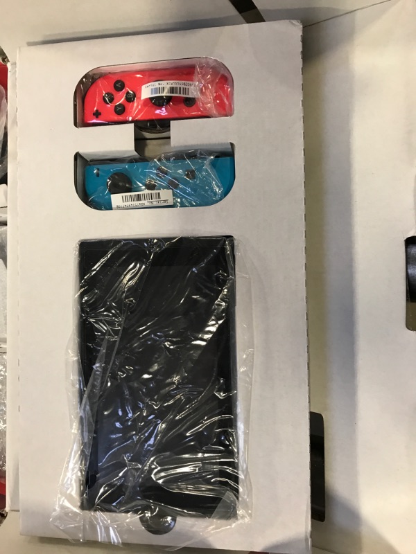Photo 2 of Nintendo Switch with Neon Blue and Neon Red Joy?Con **FOR PARTS ONLY, SERIAL NUMBER DOES NOT MATCH** 
