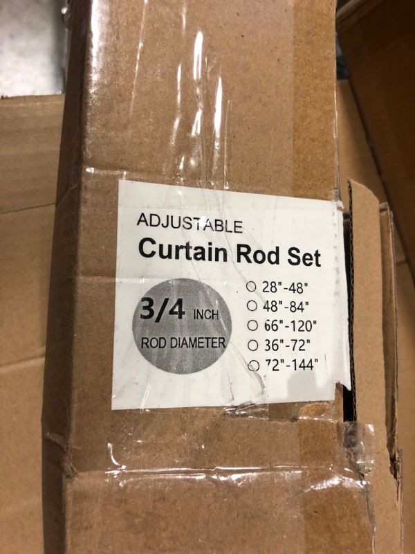 Photo 1 of adjustable curtain rod set. 28inch min