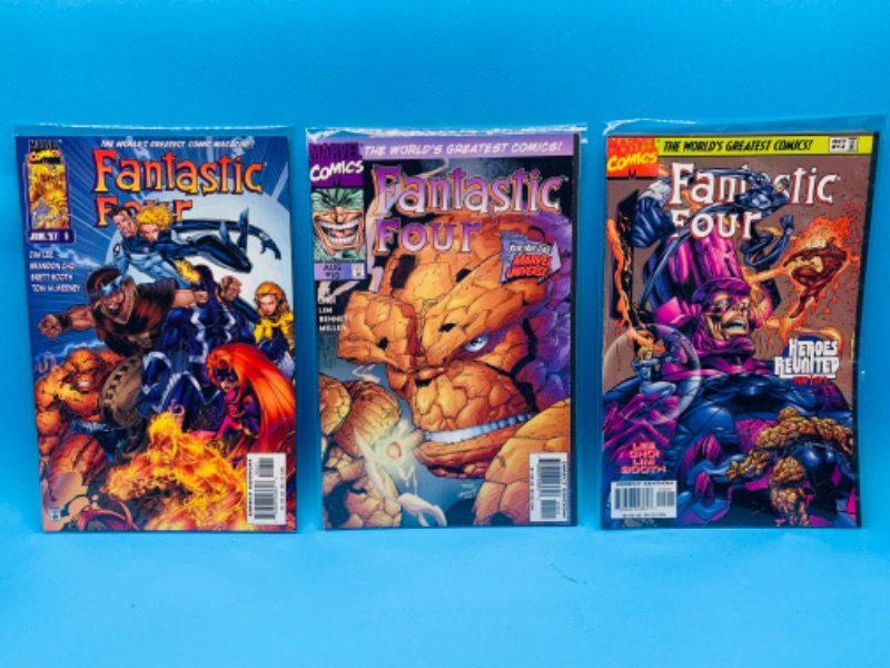 Photo 1 of 015027… 3 fantastic four comics in plastic sleeves