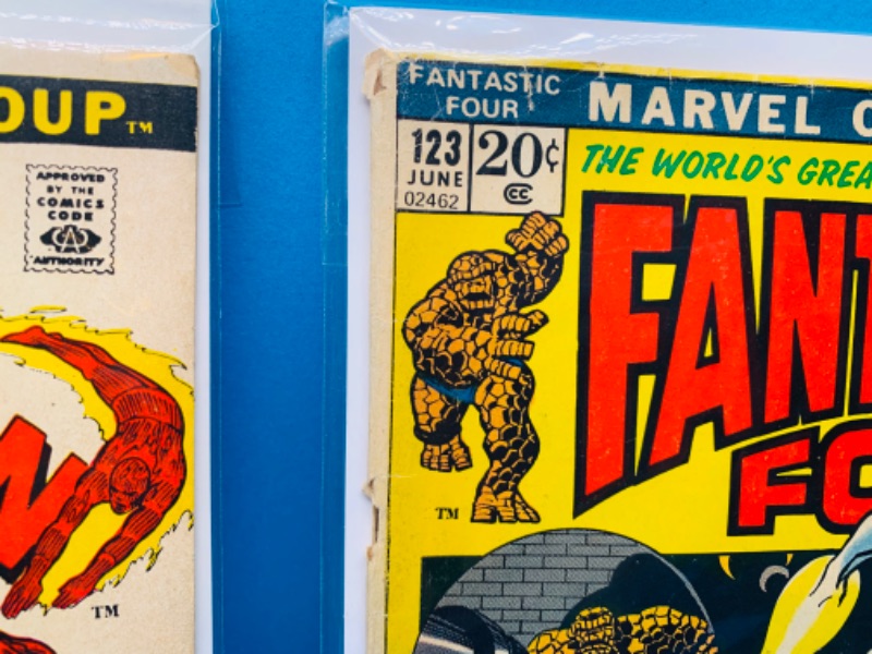 Photo 2 of 015079…vintage $.20 Spider-Man and fantastic four comics in plastic sleeves- shows wear from age 