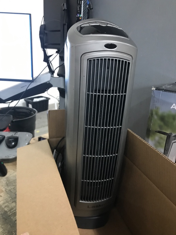 Photo 1 of **NOT FUNCTIONAL PARTS ONLY!Lasko Oscillating Digital Ceramic Tower Heater for Home with Adjustable Thermostat, Timer and Remote Control, 23 Inches, 1500W, Silver, 755320