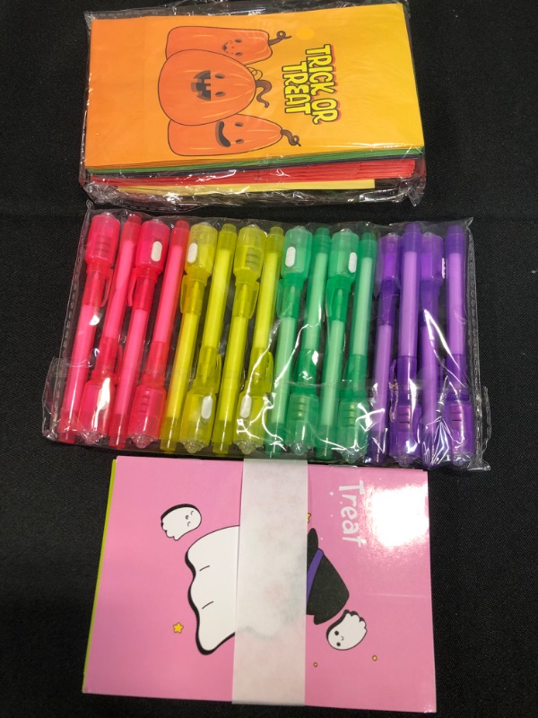 Photo 2 of BainGesk Invisible Ink Pen and Notebook, 16 Pack Halloween Party Favors with Candy Bags, Spy Pen Party Supplies, Halloween Goody Bag Stuffers, Treat Bag Fillers Non-candy Trick or Treat for kids