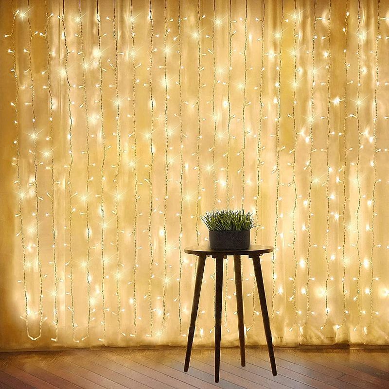 Photo 1 of Kuyang 2 Pack 300 LED 9.8 ft x 9.8 ft ( 3 m x 3 m ) Led Curtain String Light USB with 6 Hours Timer Remote for Bedroom Wedding Party ( Warm White )
