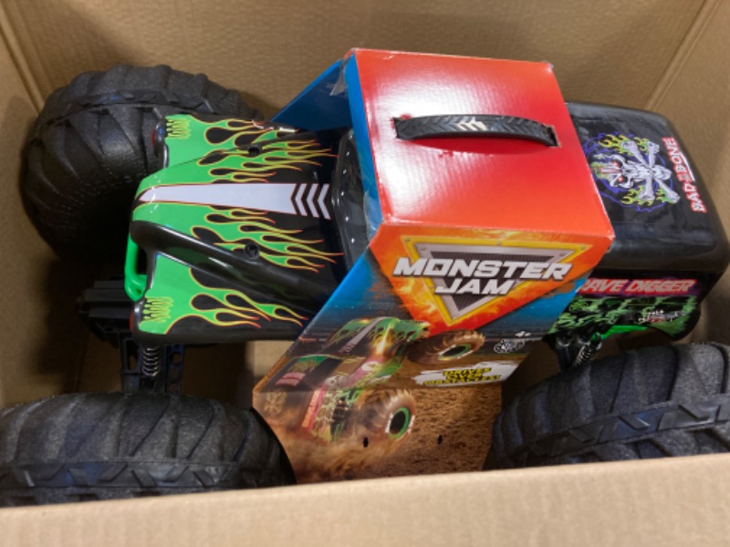 Photo 3 of BACK LEFT WHEEL IS BROKEN OFF. Monster Jam, Official Mega Grave Digger All-Terrain Remote Control Monster Truck with Lights, 1: 6 Scale, Kids Toys for Boys. ONE WHEEL IS BROKEN OFF 