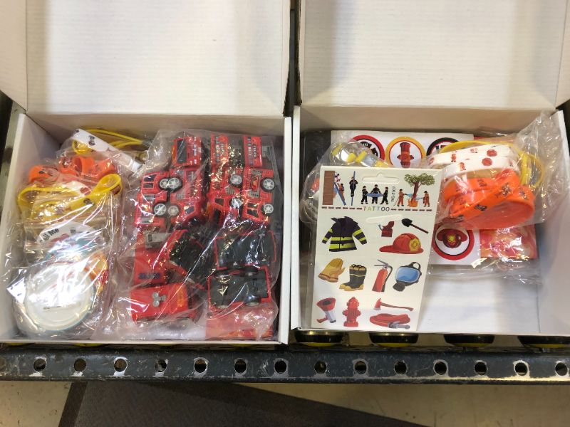 Photo 1 of HIPVVILD Fire Truck Party Favors - 72 Pcs Firefighter Birthday Party Supplies Include Gift Bag, Wristband, Button Pin, Fire Truck Toy, Keychain, Tattoo, Firefighter Party Favors for Kids Game Prizes