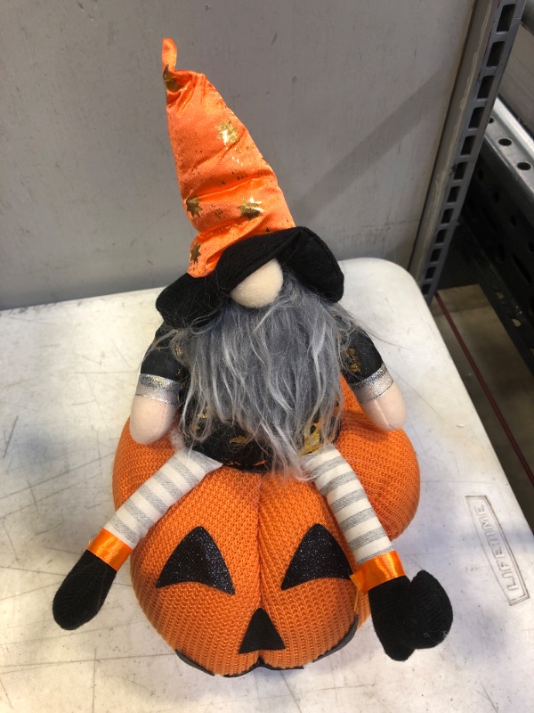 Photo 2 of GMOEGEFT Halloween Gnome Plush, Swedish Tomte Sitting on Stuffed Pumpkin with Star Pattern, Scandinavian Wizard Gnome Elf Holiday Decoration Gift
