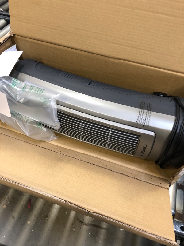 Photo 4 of Lasko 1500W Digital Ceramic Space Heater with Remote, 755320, Silver ----- PACKAGING IS DAMAGED, ITEM IS LIGHTLY USED 
